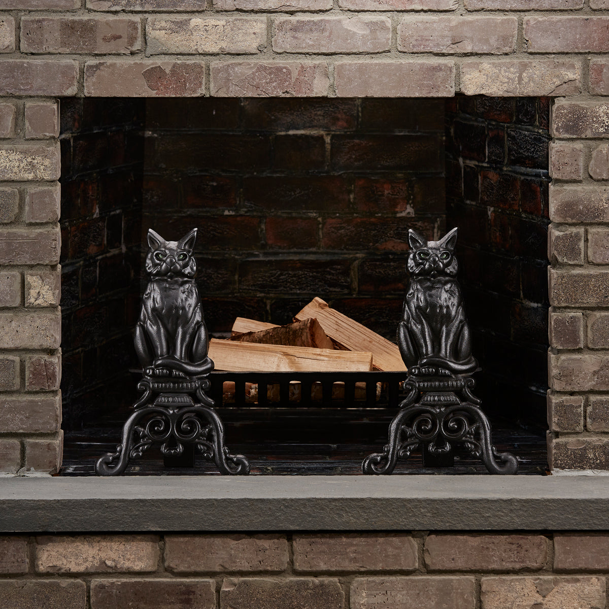 Black Cast Iron Cat Andirons with Reflective Glass Eyes | UniFlame